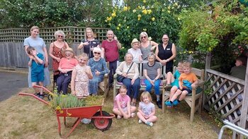  Young gardeners sow seeds of friendship at Bury care home